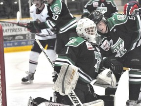 Portage Terriers goaltender Talor Joseph and defenceman Davis Ross knock heads during a 3-2 shootout loss to Dauphin Feb. 22 (Kevin Hirschfield/THE GRAPHIC/QMI AGENCY)