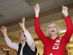 Wellington residents Liz Boultbee and Elizabeth Bygrave cheer after Canada wins the Olympic gold medal after beating Sweden 3-0 Sunday morning. Residents gathered in the Highline Hall at the Wellington and District Community centre. 
Emily Mountney/The Intelligencer/QMI Agency