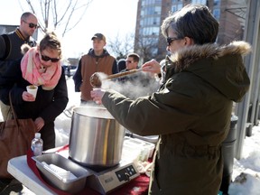 Kathy Suddard, manager of Cafe e, hands out chicken mole soup made by chef Josh LaBelle during Savour the Chill. 
Emily Mountney/The Intelligencer/QMI Agency
