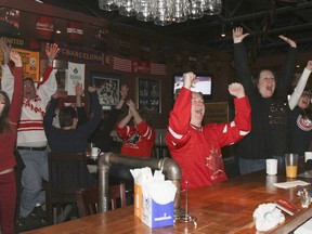 The crowd of more than 30 people at local sports bar, Jakk Tuesdays, jumped to their feet cheering when Sidney Crosby scored in the second period, putting Team Canada up 2-0 against Sweden on Sunday morning. Canada shut out Sweden 3-0 to win their second consecutive Olympic gold.
JULIA MCKAY/KINGSTON WHIG-STANDARD/QMI AGENCY