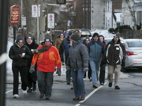 Over 75 participants, including even director Danielle McIntosh (orange) took to the streets of downtown Kingston for the Coldest Night of the Year fundraising walk on Saturday, Feb 22. The event was held in over 65 communities across Canada and helps raise money for groups that work with the homeless.
JULIA MCKAY/KINGSTON WHIG-STANDARD/QMI AGENCY