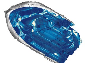 The tiny zircon crystal found on a sheep ranch in western Australia is the oldest known piece of our planet, dating to 4.4 billion years ago. (Courtesy of John Valley)