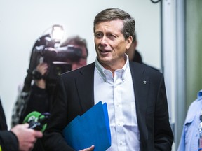 John Tory arrives at City Hall to register himself as a candidate in Toronto's mayoral race in Toronto. (ERNEST DOROSZUK/Toronto Sun)