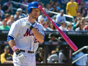 New York Mets batter Ike Davis tosses his bat after he struck out with a runner on base against the Pittsburgh Pirates in the sixth inning of their MLB National League game at CitiField in New York May 12, 2013. (REUTERS/Ray Stubblebine)