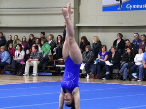 Joelle Jobin of the Southport Sapphires does a handstand at the Regional Strem Invitational on Feb. 22 at Southport Recreation Centre. (Johnna Ruocco/PORTAGE DAILY GRAPHIC/QMI AGENCY)