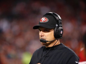 San Francisco 49ers Head Coach Jim Harbaugh seen from the sideline during the fourth quarter of his NFL pre-season football game against the Denver Broncos in San Francisco, California August 8, 2013. (REUTERS/Stephen Lam)