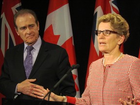 Premier Kathleen Wynne met with Deputy Mayor Norm Kelly at Queen's Park Monday. (ANTONELLA ARTUSO/Toronto Sun)