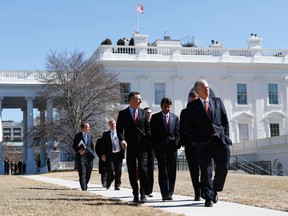 Governors walk from the White House after a National Governors Association event hosted by U.S. President Barack Obama at the White House in Washington February 24, 2014. Walking in front is Missouri Governor Jay Nixon, followed by are Vermont Governor Peter Shumlin (L) and Louisiana Governor Bobby Jindal (C). (REUTERS/Kevin Lamarque)