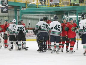 Members of the Drayton Valley Wildcats shake hands with the Whitecourt Wild at the conclusion of their game Feb. 21. The Wild defeated the Wildcats, putting an end to Drayton Valley's season.