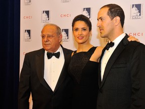 Salma Hayek poses for a photo with her father, Sami, left and her brother, Sami Junior, right, at the Congressional Hispanic Caucus Institute 2013 gala at The Walter E. Washington Convention Center on October 2, 2013 in Washington, DC.  Larry French/Getty Images/AFP