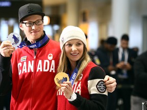 Silver medalist, halfpipe skier Mike Riddle and Gold medalist, Slopestyle skier Dara Howell return home from the 2014 Sochi Olympic winter games at Pearson International Airport in Toronto on Monday February 24, 2014. Dave Abel/Toronto Sun/QMI Agency