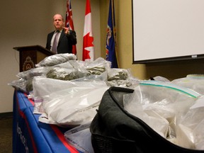 Detective Sergeant Chris McCoy of the London Police talks about the $360,000 drug bust in London, Ont. on Monday February 24, 2014. Mike Hensen/The London Free Press/QMI Agency