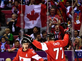 Dallas Eakins says Jonathan Toews, left, who scored the opening goal in Canada's 3-0 win over Swedn on Sunday, is a responsible player. (Ben Pelosse, QMI Agency)