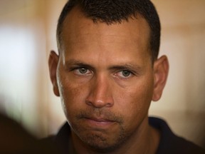 New York Yankees' Alex Rodriguez talks with reporters outside the Lakeland Flying Tigers visitor's clubhouse after reporting for his rehab assignment with the Tampa Yankees in Lakeland, Florida in this file photo taken July 5, 2013. (REUTERS/Scott Audette/Files)