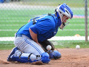 Blue Jays catcher Josh Thole blocks a pitch during drills yesterday in Dunedin. (Tommy Gilligan/USA TODAY)