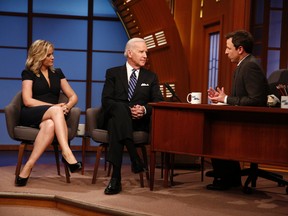 Left to right, Amy Poehler, U.S. Vice-President Joe Biden and Seth Meyers are pictured during the debut of Late Night with Seth Meyers.