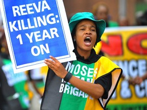 Members of the ruling African National Congress Women's League march in Pretoria on the anniversary of the killing of Reeva Steenkamp, Feb. 14, 2014. (Reuters/Stringer)