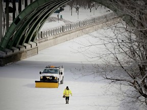 A maintenance worker prepares the Rideau Canal Skateway to reopen Tuesday, Feb. 25, 2014 after  being closed for a few days due to mild weather. The frigid temperatures are expected to remain as March rolls in this weekend.
Errol McGihon/Ottawa Sun/QMI Agency
