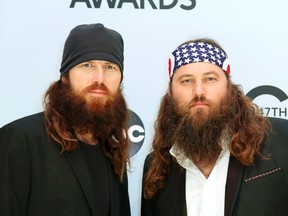 Jase Robertson (left) and Willie Robertson from "Duck Dynasty" pose on arrival at the 47th Country Music Association Awards in Nashville, Tennessee November 6, 2013. (REUTERS/Eric Henderson)
