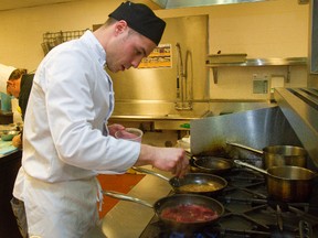 Fanshawe culinary student Terrance Copeland checks on his simmering dish of beets as he competes in Fanshawe College's Iron Chef competition Wednesday Feb 27, 2013 at the school. (Free Press file photo)