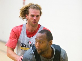 Zane Johnson guards Elvin Mims during London Lightning practice on Tuesday. Known for his shooting, Johnson has been a strong defender in his short time with the Lightning. (MIKE HENSEN, The London Free Press)