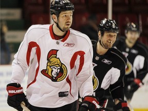 Ottawa Senators' Marc Methot, centre, will be home in Ottawa while his teammates leave the spotlight. Darren Brown/Ottawa Sun