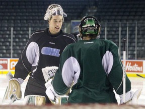 Anthony Stolarz, left, talks with fellow London Knights goalie Jake Patterson at practice at Budweiser Gardens on Tuesday.  (CRAIG GLOVER, The London Free Press)