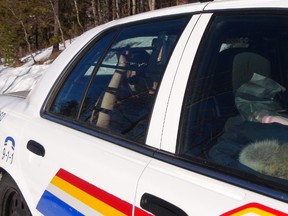 One of five people arrested near Sundre on Tuesday Feb. 25, 2014, is seen in handcuffs in the back of an RCMP cruiser. Mounties allegedly made the arrests as campers opposed to Alberta's wild horse capture season were relocating their site.
Photo courtesy of Lana Pittman