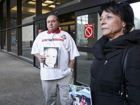 Grant McGillis and Marlene Beres hold photos of their slain son Dylan McGillis outside the court house Tuesday after reading victim impact statements. (IAN KUCERAK/EDMONTON SUN)