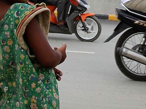 A homeless child stands on the street in Phnom Penh, Cambodia, in this May 18, 2012 file photo. (REUTERS/Samrang Pring)