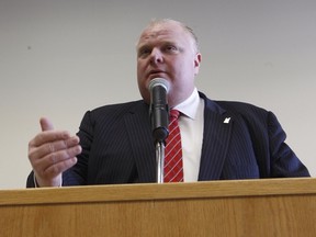 Toronto Mayor Rob Ford addresses the media before taking part in the Big City Mayors Caucus in Ottawa on Wednesday February 26, 2014. (Errol McGihon/Ottawa Sun/QMI Agency)