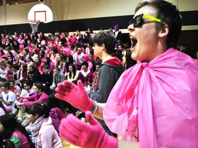 Sir Fredrick Banting secondary school student Kenny Grenier cheers during the school’s Sea of Pink Day Wednesday Feb. 26, 2014 in London, Ont. The anti-bullying campaign began in Nova Scotia in 2007 and has been celebrated at Banting for the past seven years. CHRIS MONTANINI\LONDONER\QMI AGENCY