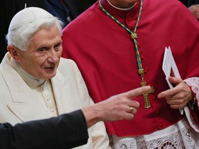 Pope Emeritus Benedict XVI arrives to attend a consistory ceremony in Saint Peter's Basilica at the Vatican February 22, 2014. (REUTERS/Max Rossi)