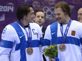 Winnipeg Jets' Olli Jokinen (right) knows he could be traded next week, but he said he's too busy savouring his Olympic experience to care at the moment. (Fred Greenslade/Reuters Files)