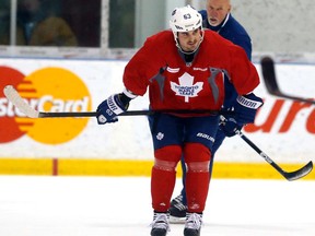 Injured Dave Bolland practises with the Toronto Maple Leafs at the Mastercard Centre in Toronto on Monday February 24, 2014. (Michael Peake/Toronto Sun)