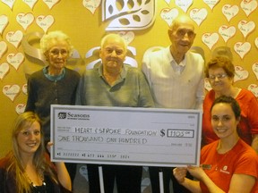 (Back row from left) Seasons residents Aileen Gooding, Jack Barnes, John Digsby, Joyce Giles joined with (front row) Brittany Kueneman of the Heart and Stroke Foundation and Rebecca Campbell, Seasons Strathroy lifestyle services manager to celebrate a donation to the organization to the tune of $1,105 recently. The final donation total – the result of a paper heart sale throughout February, aka Heart Month - has since reached $1,200.
Contributed Photo