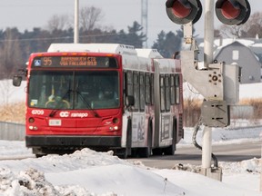 OC Transpo has hired a consultant to study whether all city buses should stop at rail crossings. Errol McGihon/Ottawa Sun