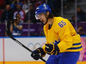Sweden's Erik Karlsson celebrates his goal against Finland during the second period of their men's play-off semi-final ice hockey game at the Sochi 2014 Winter Olympic Games, February 21, 2014.          REUTERS/Mark Blinch