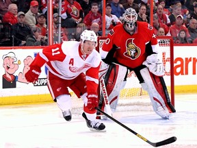 Ottawa Senators' Robin Lehner watches as Detroit Red Wings Daniel Alfredsson skates up ice during NHL action in Ottawa, Ont. on Sunday December 1, 2013. Errol McGihon/Ottawa Sun/QMI Agency