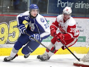 Sudbury Wolves' Kyle Capobianco battles Soo Greyhounds' Jean Dupuy for the puck  during OHL action from the Sudbury Community Arena earlier this season. GINO DONATO/THE SUDBURY STAR/QMI AGENCY
