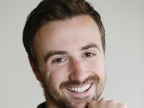 Auto racer James Hinchliffe poses at Steam Whistle Brewery in Toronto after being interview by the Dean of Speed. (Stan Behal/Toronto Sun)