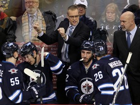 Winnipeg Jets head coach Paul Maurice signals to his players during a game against the Phoenix Coyotes in Winnipeg, Man. Monday, January 13, 2014. (Brian Donogh/Winnipeg Sun/QMI Agency)