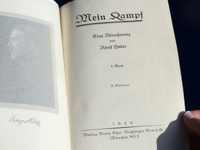 One of two rare copies of "Mein Kampf" signed by the young Nazi leader Adolf Hitler and due for auction, photographed in Los Angeles, California on February 25, 2014.    AFP PHOTO/Frederic J. BROWN