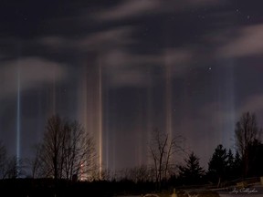 Jay Callaghan's photographs captured a light pillar display in Peterborough, Ont., on February 25, 2014. (Jay Callaghan/Facebook)