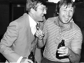 Deposed former NHLPA director Alan Eagleson and Team Canada defenceman Brad Park share a laugh and a beer after the historic 1972 Summit Series. Note the stubby bottles. (TORONTO SUN PHOTO)
