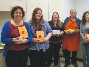 Wallaceburg District Secondary School PSW students held a fundraiser for the Helping Hands Breakfast program. The PSW Potluck Cookbook Committee raised funds in the sale of their cookbook and was able to donate $500 to the Helping Hands Breakfast Program at W.D.S.S. Presenting the check are from left to right, Lisa Zandbergen PSW teacher; Samantha Ashton; Shelby Churcher; Joe Myers, volunteer; Kyrstan Puskas and Joyce Myers, volunteer.