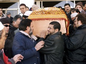 Mourners carry the casket following the funeral of Mir Hussain at the Canadian Islamic Centre on 113 St., and 130 Ave., on January 6, 2004. Mir Hussain, 44, an Imperial Park employee, died after he was stabbed in  the torso during an argument while on duty at the intersection of 121 St., and 104 Ave., on Jan. 2, 2004. Edmonton Sun