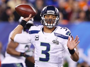 Seattle Seahawks quarterback Russell Wilson throws a pass against the Denver Broncos during the Super Bowl in East Rutherford, N.J., February 2, 2014.  (REUTERS/Shannon Stapleton)