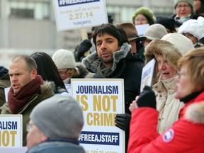 Canadian journalists, including CBC's Jian Ghomeshi,  hold a vigil in Toronto's Nathan Phillips Square on Feb. 27, 2014 for the three Al Jazeera journalists imprisoned in Egypt (Michael Peake/Toronto Sun)