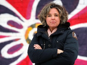 Eva Cooper, owner of Delilah's, is photographed outside her Glebe location in Ottawa on Thursday February 27, 2014. The Quebec government is asking her to shut down her mostly english Facebook page as she also has a store location in Chelsea, QC. Darren Brown/Ottawa Sun